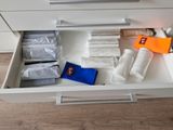 a drawer that has a lot of items in it