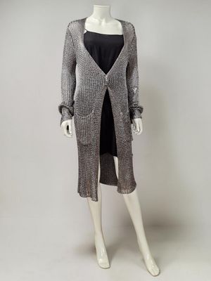 an image of a mannequin mannequin wearing a gray sweater and black dress