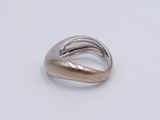 a close up of a silver ring on a white surface