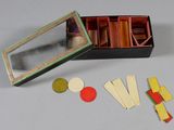 a box with a mirror, a mirror, and some pieces of paper