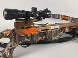 a close up of a rifle with a scope on a white background
