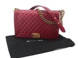 a chanel red quilted bag with gold hardware and chain