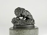 statue of a lion on a stone base with a white background