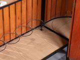 a wooden shelf with a pair of glasses on top of it