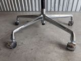 an image of a chromed office chair with wheels