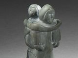 a statue of a man holding a baby in his arms