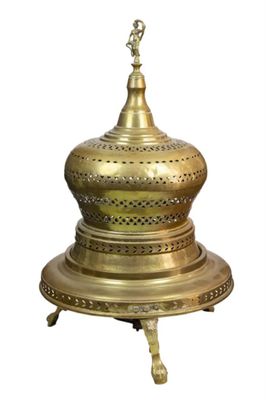 an image of a gold plate with a bird on top