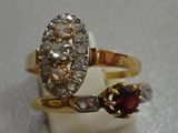a gold ring with a garnett and a garnett on top of it