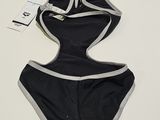black and grey swimsuit with grey trimmings on a white surface