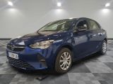 a blue toyota corollant parked in a room with a checkered floor