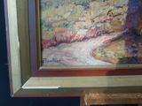 a picture of a painting on a easel in a room