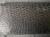 a black purse that is sitting on a table