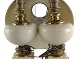 pair of white and gold table lamps on marble bases