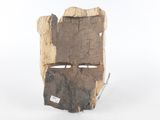 a piece of wood that has a face on it