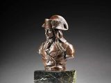 a bronze busturine of a soldier on a marble base