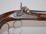 an old gun with a metal handle on a white background
