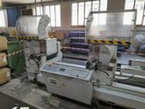 a machine that is working on a piece of paper
