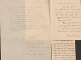 three papers with handwriting on them sitting on top of a table