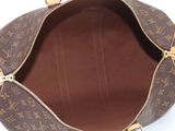 the inside of a louis vuitton bag with a zipper open