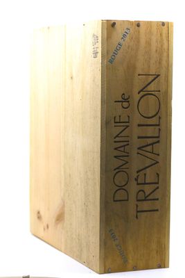 a wooden box that has a knife and a knife rest on it