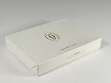 a white box that has a gold logo on it
