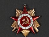 a close up of a red star with a hammer and stars on it