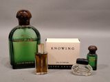 an image of a bottle of perfume next to a box of perfume