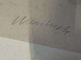 a picture of someone writing on a piece of paper