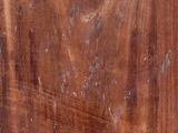 an image of a wooden cutting board with a knife on top of it