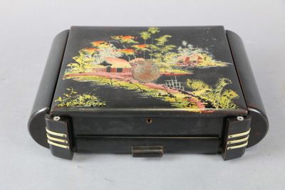 a small black box with a painting on it