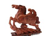 a statue of a horse with a rider on it ' s back