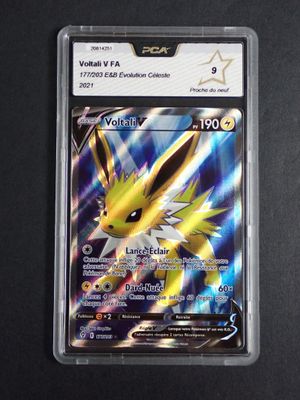 a close up of a pokemon card on a black surface