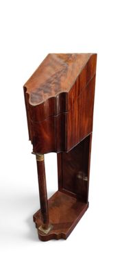 a small wooden table with a drawer on it