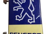 un panneau bleu et jaune sur lequel figure un lion