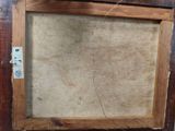 an old picture frame with a picture of a cat hanging on it