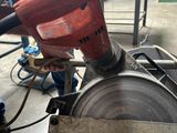 a man that is working on a machine in a factory