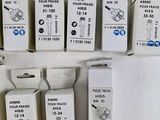several boxes of different sizes and colors of electronic devices on a white surface