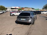 a lot of cars parked in a parking lot