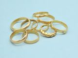 a pile of gold rings on a blue surface