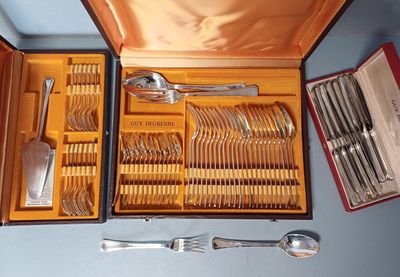 many silverware in a case on the table