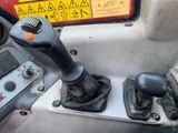a close up of a car ' s dashboard with a steering control
