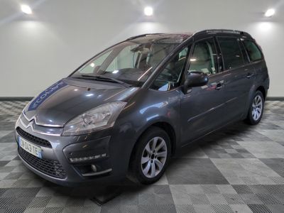 the grey citrole is parked on a checkered tile floor