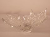 a glass bowl that has a leaf design on it