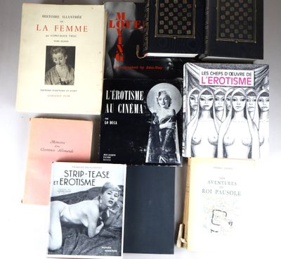 several books are sitting on a white surface next to each other