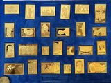 a picture of a display of gold coins on a blue wall