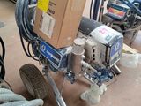 a machine that is sitting on the floor with a box on it