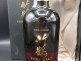 une photo d'une bouteille de whisky de malt pur de 25 ans d'âge
