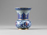 a blue and white vase sitting on a table