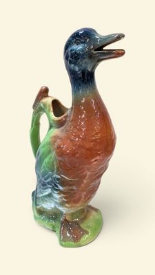 SAINT CLEMENT Pichet zoomorphe en faïence polychrome figuran…