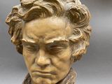statue of a bust of a man with a scarf around his neck